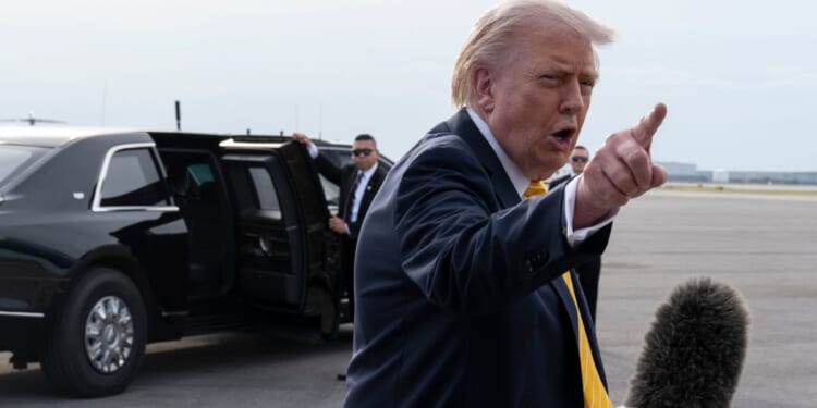 President Donald Trump speaks to journalists at Palm Beach International Airport on May 2, 2026 in Palm Beach, Florida.