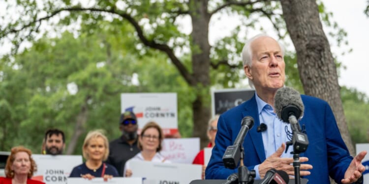 Sen. John Cornyn speaks during a news conference after casting his vote during early voting in the primary runoff at the Circle C Community Center on May 18, 2026, in Austin, Texas.