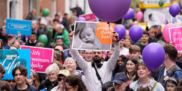 Pro-life campaigners take part in a march.