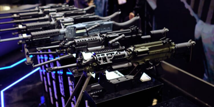 Rows of rifles sit at a gun expo on May 8, 2026.