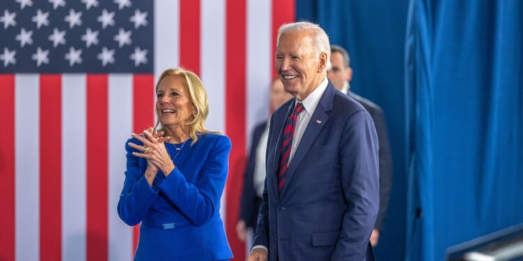 President Joe Biden and first lady Jill Biden exit the stage after the President spoke at the International African-American Museum on Jan. 19, 2025, in Charleston, South Carolina.