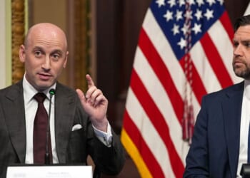 White House Deputy Chief of Staff Stephen Miller, left, speaks as Vice President J.D. Vance looks on during a roundtable discussion on anti-fraud initiatives Tuesday. Miller said the U.S. could balance the federal budget by eliminating all of the fraud in government programs.