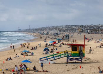 A packed beach during the Memorial Day holiday weekend on May 25, 2025, in Hermosa Beach, California.