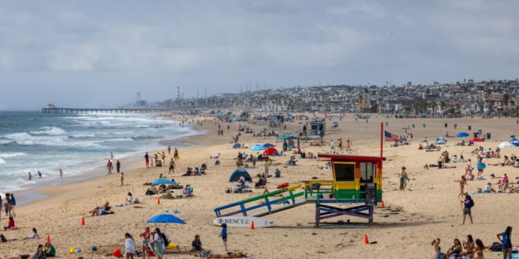 A packed beach during the Memorial Day holiday weekend on May 25, 2025, in Hermosa Beach, California.