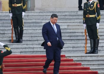 President Xi Jinping walks down the stairs of the Great Hall of the People on May 12, 2026 in Beijing, China.