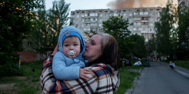 Russian attack kills at least 18 in Ukraine, some of them children buried under rubble