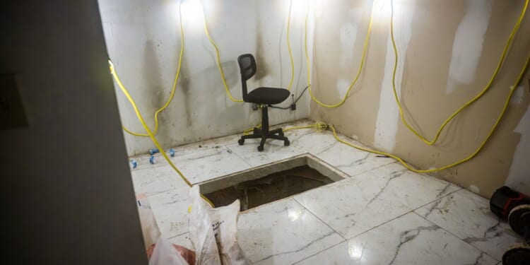 Four charged with smuggling cocaine via tunnel that connected fake San Diego storefront to Mexico
