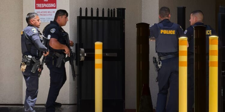 Police say man barricaded himself inside bank with others in California city of Bakersfield