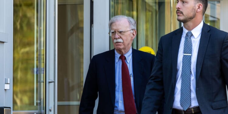 Former U.S. National Security Advisor John Bolton leaves federal court after pleading not guilty to charges of mishandling classified material on Oct. 17, 2025, in Greenbelt, Maryland.