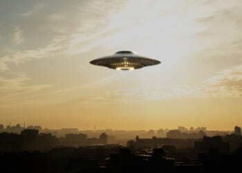 A strange flying machine in the shape of a saucer, silently hovering in the air. It emits a bright light and seems to scan the surrounding space with a beam.