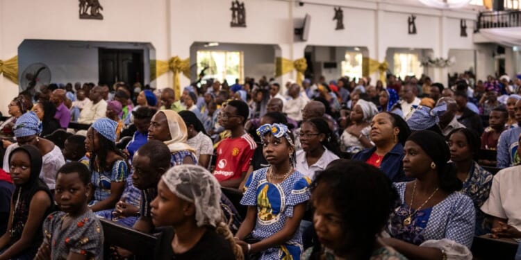 Roman Catholics gather for a mass at the Church of the Assumption in Lagos, Nigeria, on April 21, 2025.