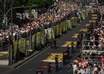 1 million people flood Madrid streets to see the pope’s flower-carpeted procession