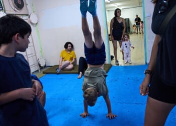 After morning of sirens, Israelis fall back into well-worn war routines