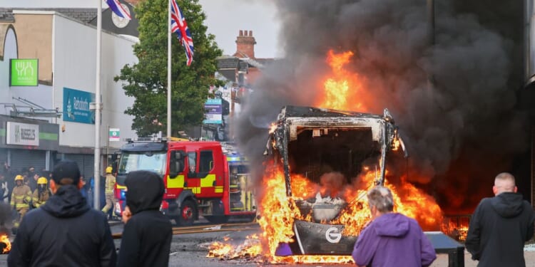 Belfast riots spread to second night as police deploy water cannons