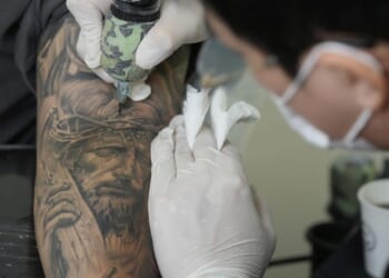 Crypto site pays people to tattoo ads on themselves