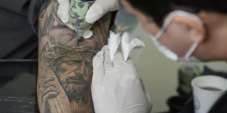Crypto site pays people to tattoo ads on themselves