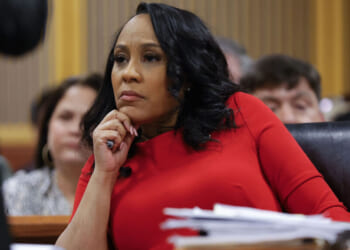 ATLANTA, GA - MARCH 01: Fulton County District Attorney Fani Willis looks on during a hearing in the case of the State of Georgia v. Donald John Trump at the Fulton County Courthouse on March 1, 2024, in Atlanta, Georgia. The hearing is to determine whether Fulton County District Attorney Fani Willis should be removed from the case because of a relationship with Nathan Wade, special prosecutor she hired in the election interference case against former President Donald Trump. (Photo by Alex Slitz-Pool/Getty Images)