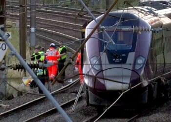 Two trains collide north of London, killing at least 1 person and seriously injuring dozens
