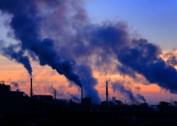 Pollution smoke from a factory plant pumping smoke into the air.