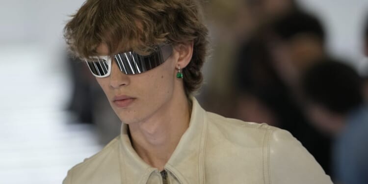 Milan designers go lighter in silhouette, if not materials, for next summer