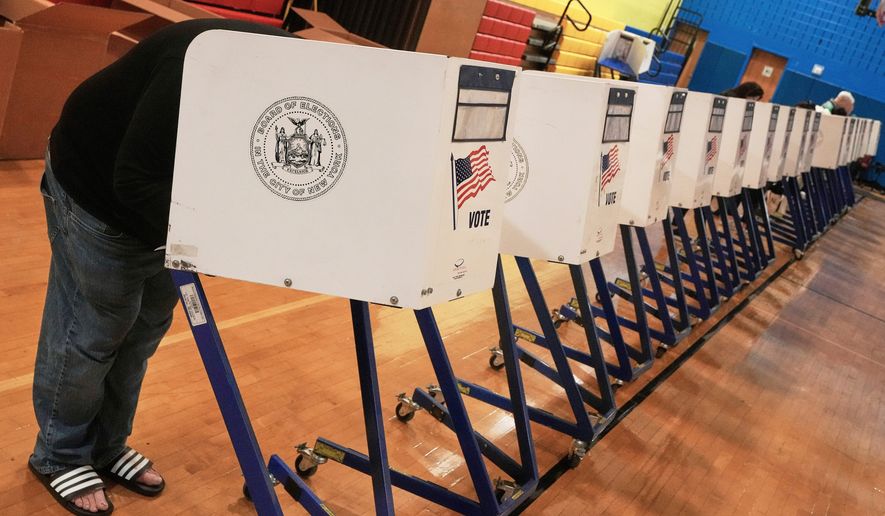FILE - A voter completes their ballot at a voting site, in New York, Nov. 4, 2025. (AP Photo/Richard Drew, File)