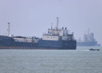 Iran moves to control commercial shipping in Strait of Hormuz, issues warning after vessel is struck