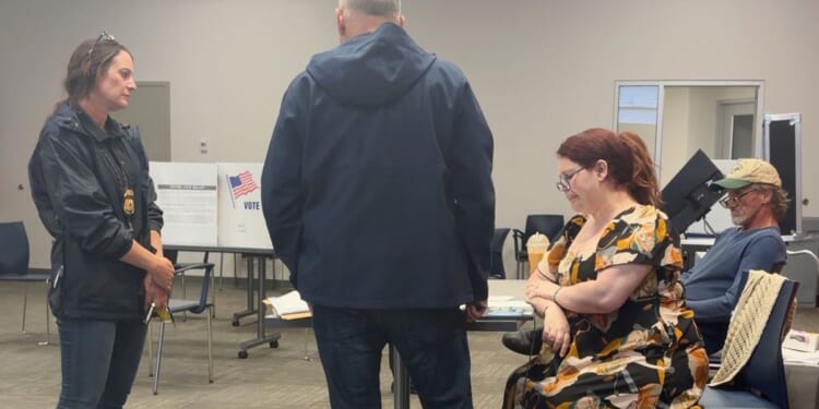 Election worker says federal officers confronted her at polls over social media post criticizing ICE