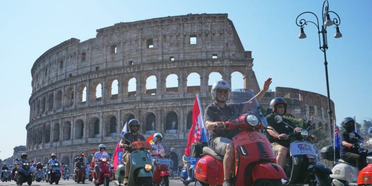 Thousands of Vespas swarm Rome’s historic center to mark iconic scooter’s 80th anniversary