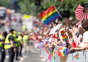 An attendee waves a pride flag at the Capitol Pride Parade on June 20, 2026 in Washington, DC.