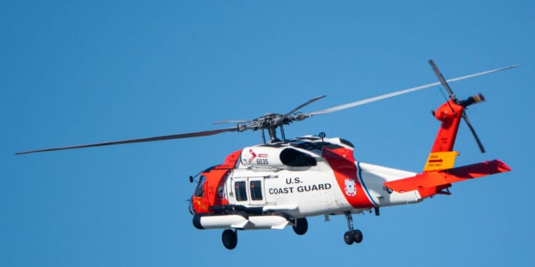 A U.S. Coast Guard Sikorsky MH-60T Jayhawk helicopter approaches the U.S. Coast Guard Sector San Diego air station on Dec. 20, 2024, in San Diego, California.