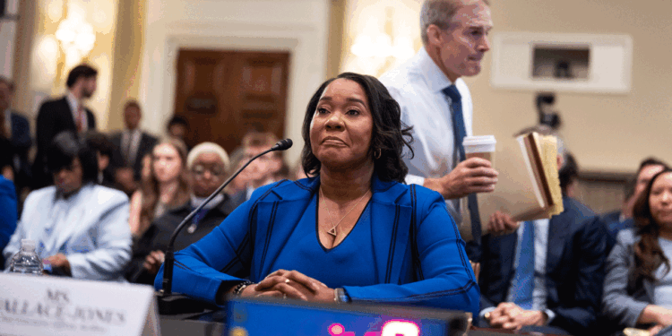 Rep. Jim Jordan, R-Ohio, walks by Regina Wallace-Jones, CEO of ActBlue, as she prepares to testify during the House Administration Committee hearing titled "Preventing Fraudulent Donations: Transparency, Verification, and Accountability," in Longworth building on Wednesday, June 10, 2026. Wallace-Jones invoked her Fifth Amendment privilege. (Tom Williams/CQ-Roll Call, Inc via Getty Images)