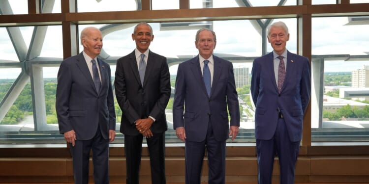 Former President Joe Biden, former President Barack Obama, former President George W. Bush, and former President Bill Clinton pose ahead of the dedication ceremony for the opening of the Barack Obama Presidential Center, in John Lewis Plaza, on June 18, 2026, in Chicago, Illinois.