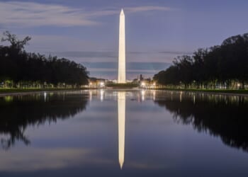 The Washington Monument is reflected in the National Mall's Reflecting Pool in an April 2025 twilight photo.