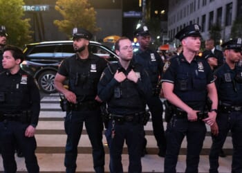 NYPD monitors Knicks fans celebrating winning the eastern conference championship against the Cleveland Cavaliers on May 25, 2026, in New York City.