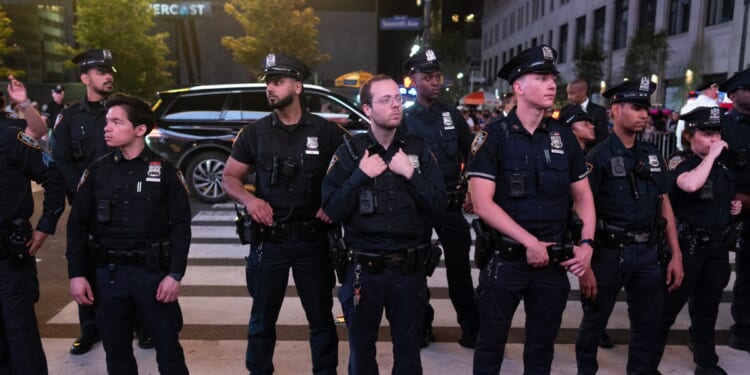 NYPD monitors Knicks fans celebrating winning the eastern conference championship against the Cleveland Cavaliers on May 25, 2026, in New York City.