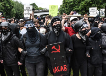 Members of Antifa line up during an alt-right rally on August 17, 2019 in Portland, Oregon.