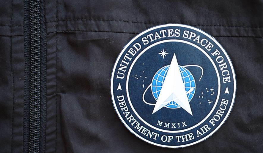 U.S. Space Force Department of the Air Force coat of arms as a pin on a black uniform jacket close up. KYIV, UKRAINE - JUNE 26, 2024 File photo credit: Mehaniq via Shutterstock.