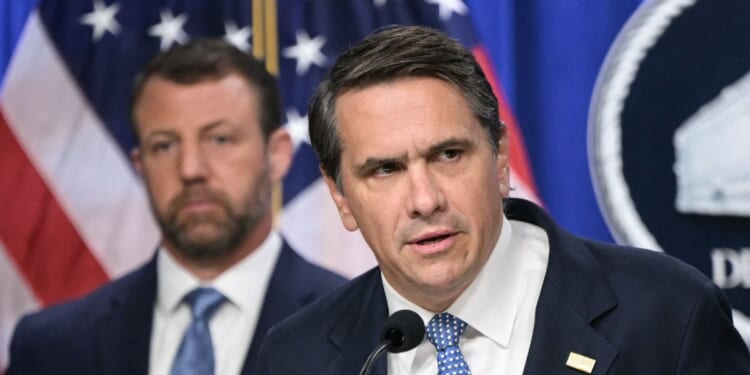 Acting Attorney General Todd Blanche, alongside Secretary of Homeland Security Markwayne Mullin, speaks during a press conference about safeguarding unaccompanied immigrant children at the Department of Justice headquarters in Washington, D.C., on June 11, 2026.