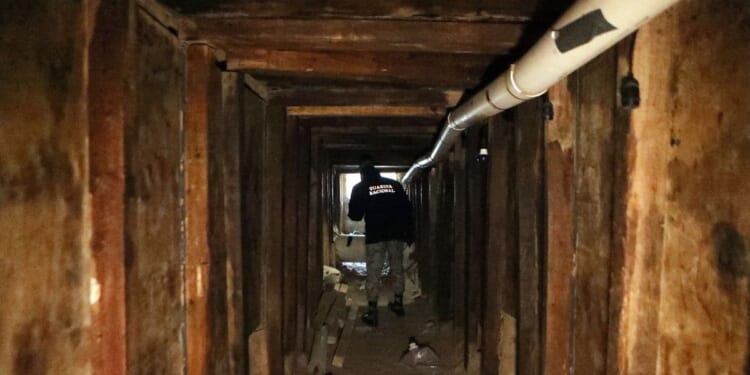 A National Guard agent inspects an illegal tunnel bound to El Paso, at the Mexico-U.S. border in Ciudad Juarez, Mexico, on Jan. 18, 2025.