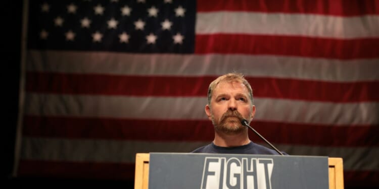 Democratic U.S. Senate candidate Graham Platner of Maine speaks May 24 at a “Fighting Oligarchy” tour stop held by Vermont Sen. Bernie Sanders in Orono, Maine.