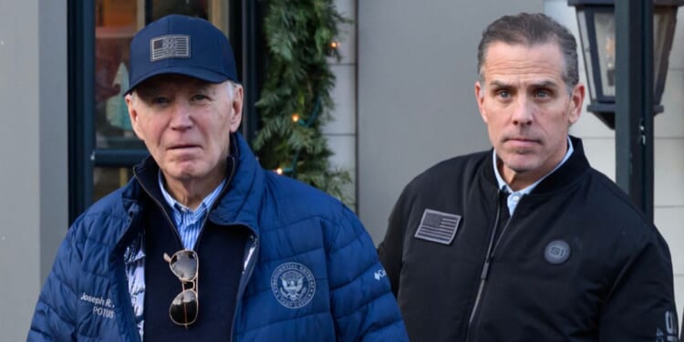 A photo shows President Joe Biden and son Hunter Biden stepping out of a bookstore while shopping in Nantucket, Massachusetts, on Nov. 29, 2024.