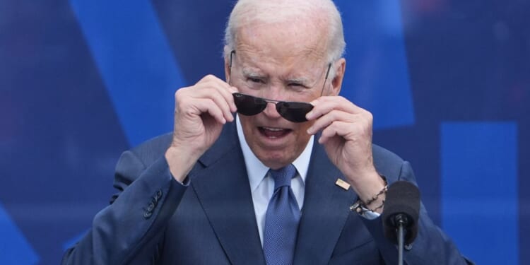 Biden accuses Trump of corruption then struggles to find way off stage