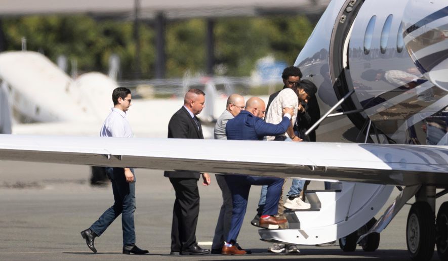 Harjinder Singh is escorted onto an airplane by Florida Lt. Gov. Jay Collins and law enforcement in Stockton, Calif., on Thursday, Aug. 21, 2025. (AP Photo/Benjamin Fanjoy) ** FILE **