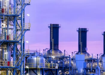 A chemical plant operates as dusk falls.
