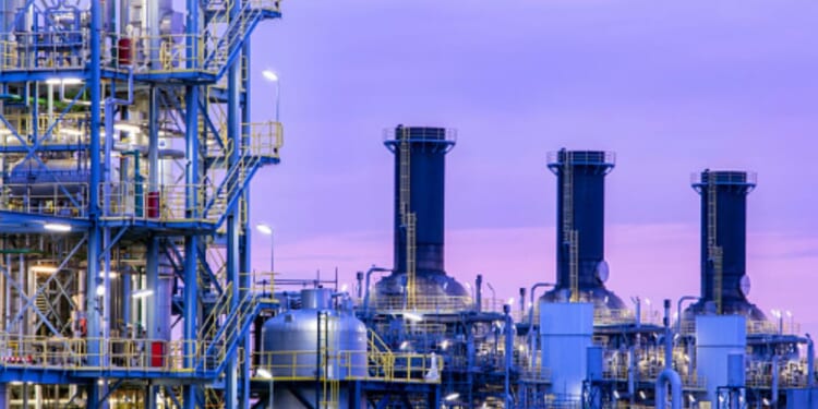 A chemical plant operates as dusk falls.