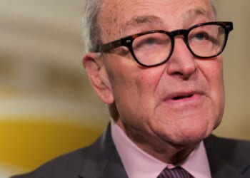 Senate Minority Leader Chuck Schumer stands in a hallway as he takes questions from the press on June 2, 2026.