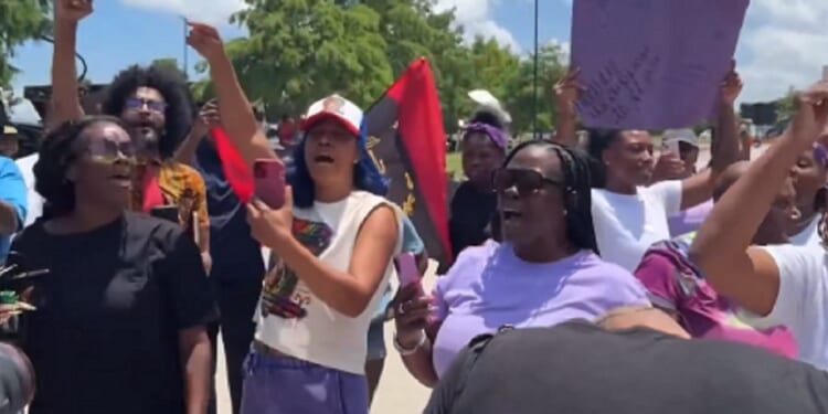 Demonstrators protest the guilty verdict Tuesday in the Karmelo Anthony murder trial.