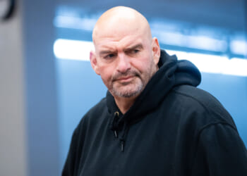 John Fetterman walks through the capitol complex.
