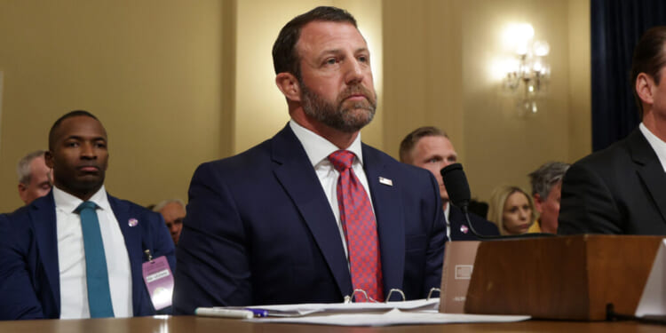 Secretary of Homeland Security Markwayne Mullin (C) and Deputy Secretary of Homeland Security Troy Edgar (R) testify during a House Committee on Homeland Security hearing in the Cannon House Office Building on June 03, 2026 in Washington, DC. The hearing was held to examine the Department of Homeland Security's budget request for fiscal year 2027. (Alex Wong/Getty Images)