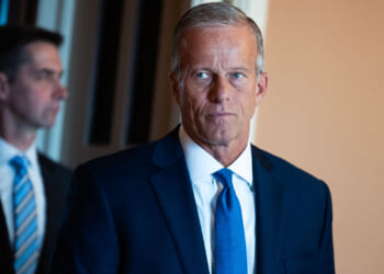 Senate Majority Leader John Thune walks through the Capitol.